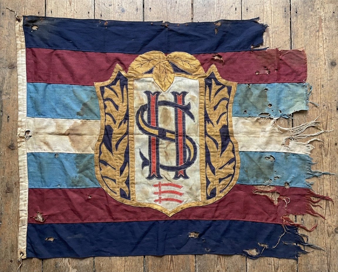 The club crest on a flag in the club colours