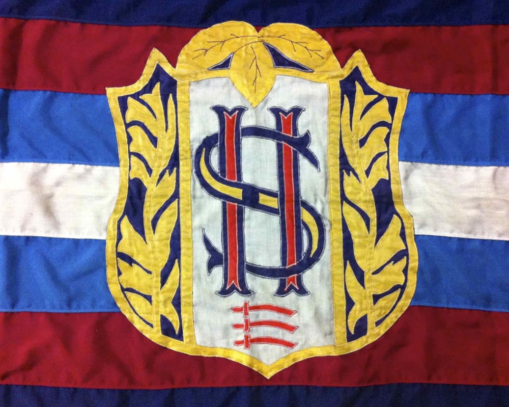 The club crest on a flag in the club colours